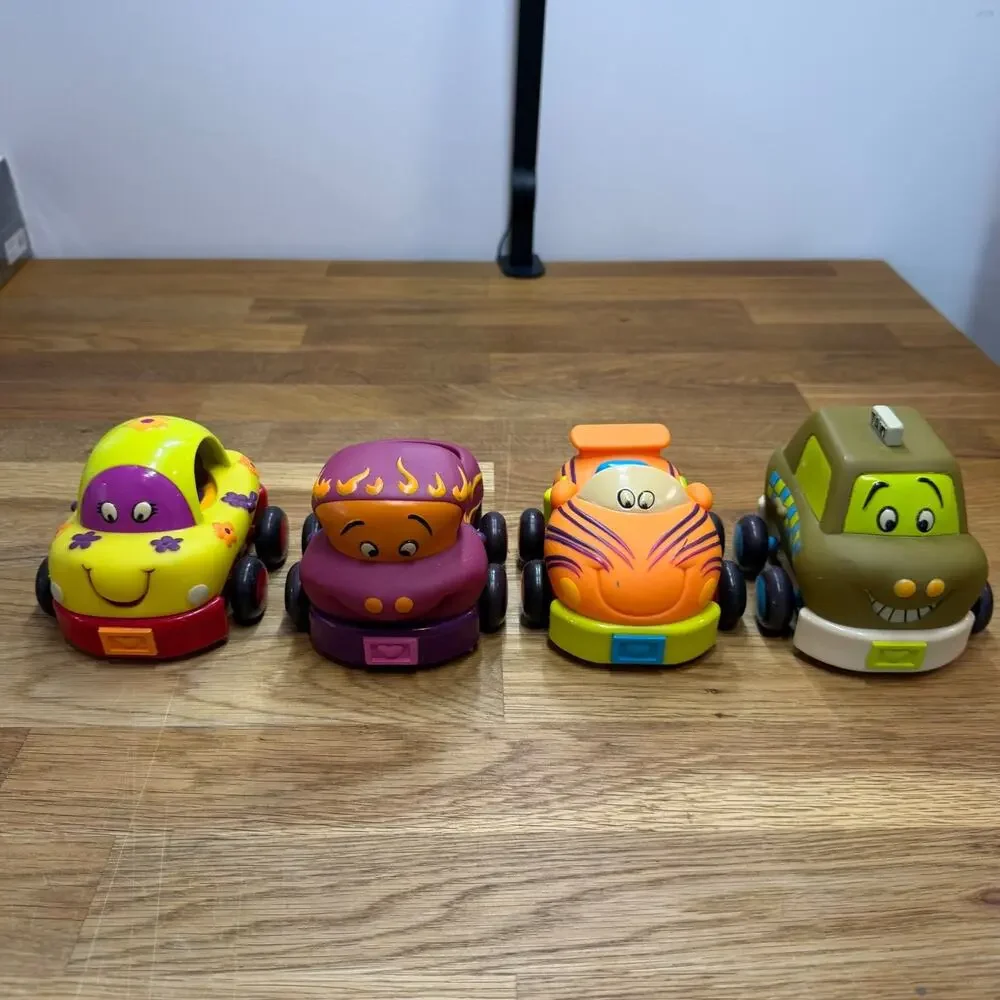 B. Toys Pull Back Trucks Taxi Cab Convertible Lot of 4 Flower Car Play Imaginati